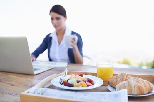 Food, laptop and breakfast outdoor, woman and table with healthy meal, freelancer and online. Person, worker and writing with technology, pc and creative with coffee in remote work and business