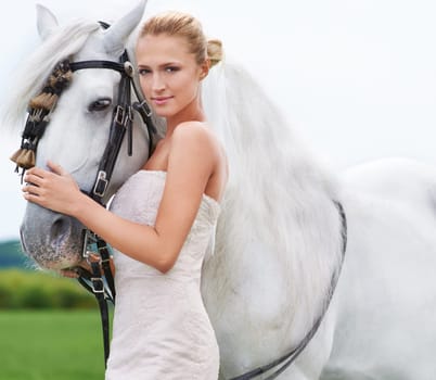 Bride, horse and field with portrait, event and animal for marriage, celebration and happiness. Woman, uk countryside and meadow with spring, sky and nature for wedding, love and relationship