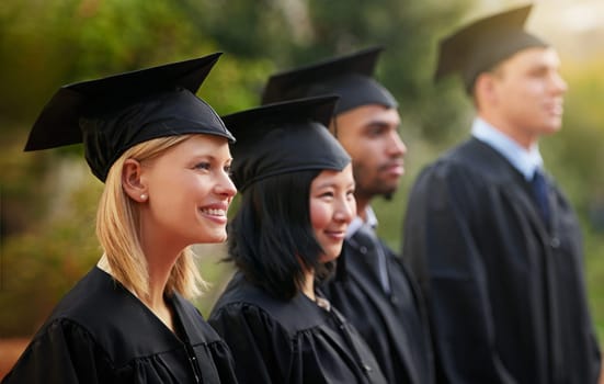 Smile, graduation and woman student in line with friends at outdoor ceremony for college or university. Education, scholarship or achievement with graduate men and women at academic school event