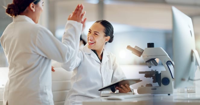 Teamwork, scientist or doctors high five for success, medicine breakthrough or partnership in lab. Science, collaboration or happy women celebrate medical support, goal target or DNA news with smile
