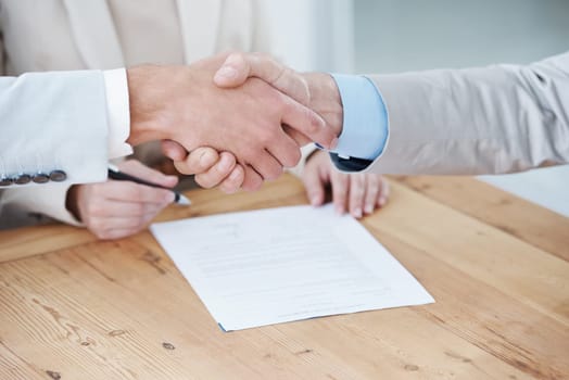 Shaking hands, business people and contract, onboarding with human resources in meeting or interview. Paperwork, cooperation and partnership with signature, recruitment and handshake for welcome