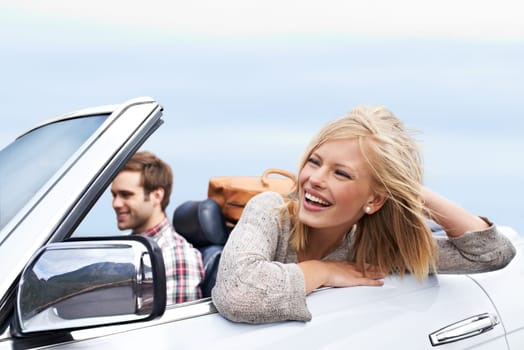 Happy, travel and couple in car for transportation on adventure, holiday or vacation with suitcases. Smile, love and young man and woman driving in vehicle for weekend road trip journey together