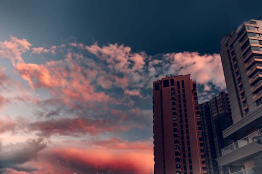 Skyscrapers Over Pink Sunset Sky Background