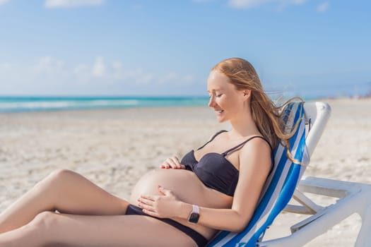 Basking in seaside tranquility, a pregnant woman lounges on a sun lounger, embracing the soothing ambiance of the beach for a moment of serene relaxation