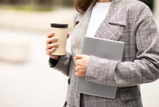 Woman Holding Digital Tablet And Paper Coffee Cup Outdoor, Cropped