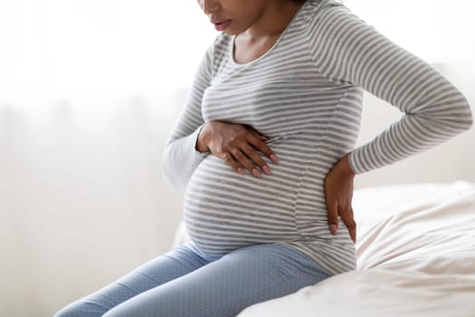 Pregnancy Pain. Cropped Shot Of Black Pregnant Lady Feeling Unwell At Home
