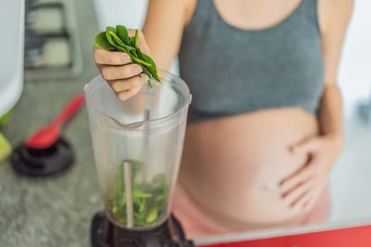 Embracing a nutritious choice, a pregnant woman joyfully prepares a vibrant vegetable smoothie, prioritizing wholesome ingredients for optimal well-being during her maternity journey