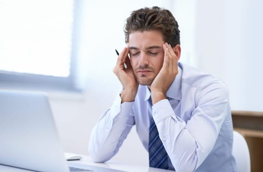 Headache, pain and business man with stress, fatigue and anxiety for overwork in office. Migraine, depression and professional massage temples for burnout, sick and tired agent frustrated by laptop