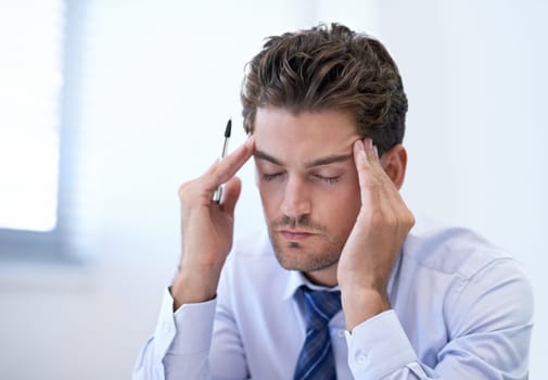 Headache, stress and business man with burnout, pain and anxiety for overwork in office. Migraine, depression and professional massage temples for fatigue, sick and tired agent frustrated in company