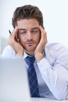 Sick, headache and business man with pain, stress and anxiety for overwork in office. Migraine, depression and professional massage temples for burnout, fatigue and tired person frustrated by laptop