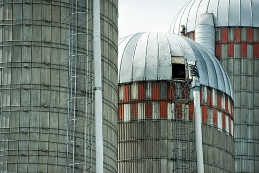 grain wheat metallic silo on cloudy sky background