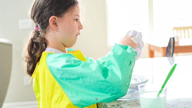 Homeschooled Little Girl Crafting Slime in Modern Kitchen