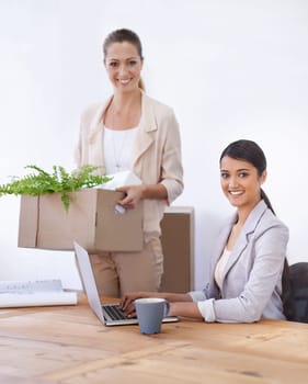 Portrait, women and moving to office with laptop, smile and opportunity for entrepreneurship together. Computer, startup and business people with box for relocation, new workplace and partnership.
