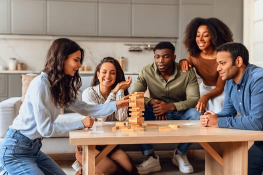 friends gathering around table engaging in lively board game indoor