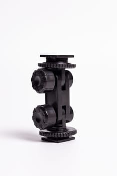 Black plastic Adapter for mounting a Hot Shoe tripod