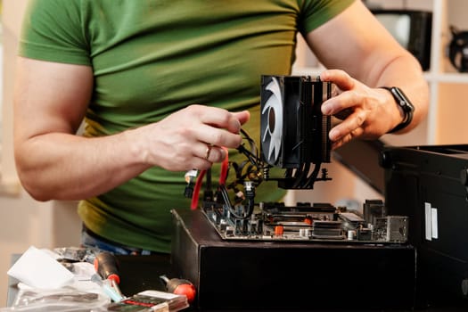 Close up of man repairing computer system unit