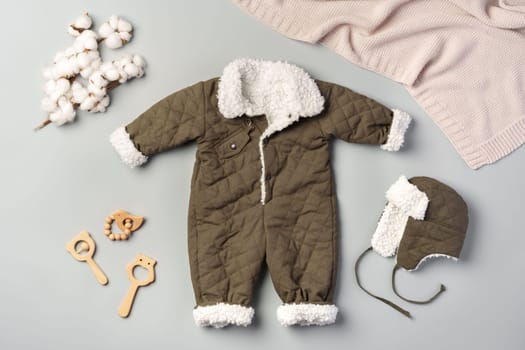 Gray quilted baby overalls for winter flat lay