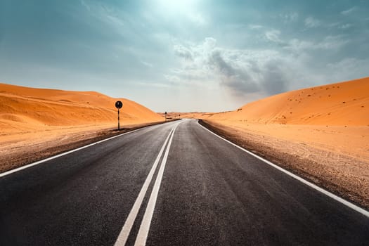 Highway Among Dry Sandy Desert