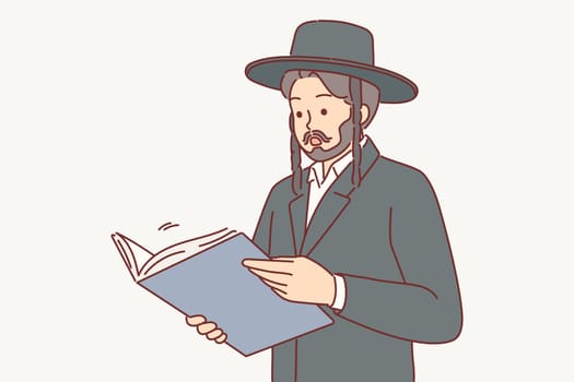Man in jewish traditional clothing reads book or business documents and shows surprised emotions
