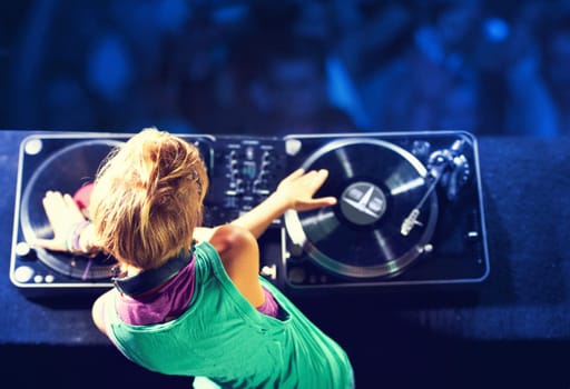 Person, hands and turntable for nightclub performance for celebration dance party for listen, entertainment or event. Dj, headphones and techno in Florida for new year crowd, audience or electronic