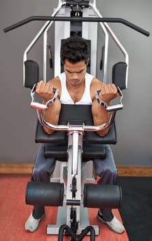 Bench, weights and man with gym machine, workout and challenge with endurance and progress. Bodybuilder, person and guy in a health center, strong and exercise with strength training and fitness