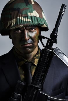 Soldier, man and gun in portrait with camouflage face paint for conflict, war and suit for corporate crime. Person, rifle and helmet in military gear with anger for battle, challenge or human rights