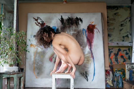 young beautiful woman posing nude in the studio