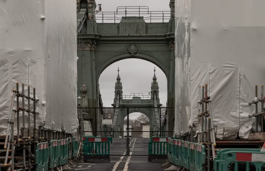 Hammersmith Bridge closed for while undergoing a complete refurbishment and repairing. One of the world's oldest suspension bridges and a major river crossing and primary route in west london, The approach to a heavily closed, Copy space,