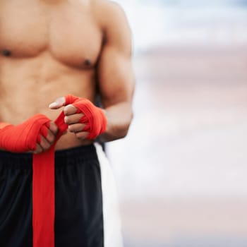 Man, hand and wrap for mma, protection and strength at fitness and workout studio with mockup. Person with strap, fist or fingers to bandage and protect for exercise, training or competitive fighting