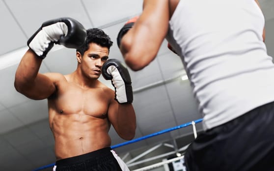 Boxer, man and fight in boxing ring for practice, training or confidence for performance with coach or fitness. Professional, athlete or exercise for competition, match or sport with personal trainer