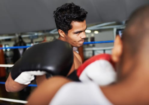 Boxer, man and fight in boxing ring for training, workout and confidence for performance with coach and fitness. Professional, athlete and exercise for competition, match and sport with endurance