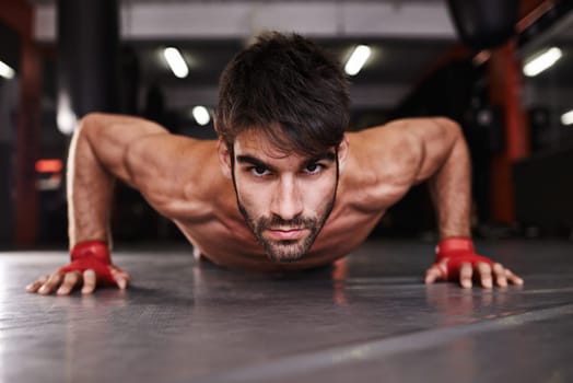 Man, portrait and push up or fitness in gym, athlete and topless for exercise and workout. Male person, body builder and performance for challenge or practice, training and serious for competition