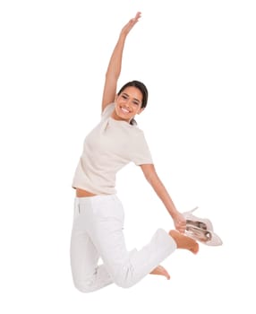 Woman, excited and jump in studio for success, winning and achievement with fashion, bonus or sale. Excited portrait of winner for freedom, yes or celebration in air with heels on a white background