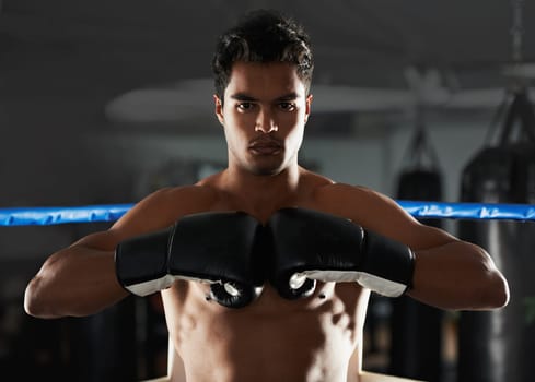 Boxer, man and gym with sport, boxing ring and confidence for workout or training. Person, exercise and fitness for health, wellness and motivation for winning with commitment for professional fight
