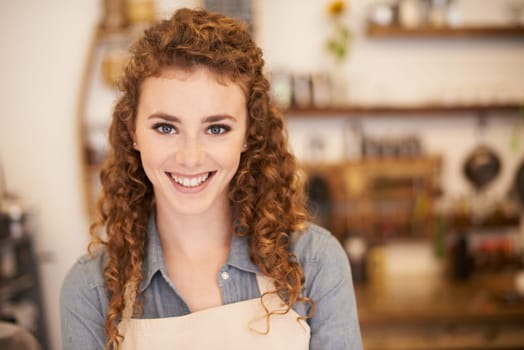 Portrait, restaurant and happy woman with confidence in small business for service with pride in bakery. Coffee shop, cafe and face of girl waitress with hospitality, smile or entrepreneur at startup