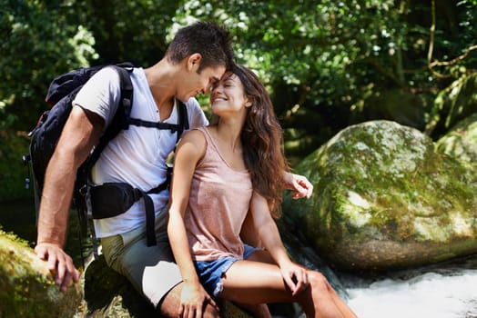 Romantic, nature and couple by river for hiking, trekking and adventure for wellness, relax and explore. Dating, love and happy man and woman on holiday, vacation and travel on weekend for bonding