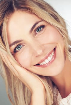 Closeup, makeup and portrait of woman with smile for cosmetic, beauty and healthy skin for wellness. Happy, face and female person with hand for relaxing with skincare, dermatology or self care.