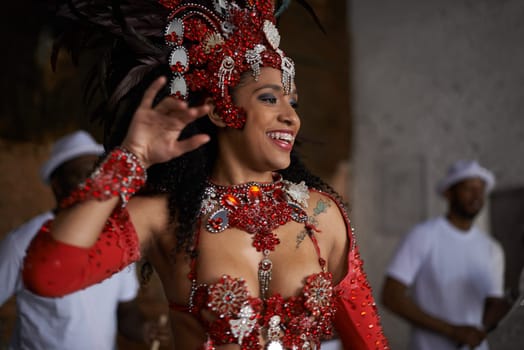 Carnival, dance and woman in costume for event in Brazil, performer or dancer with gemstone outfit outdoor. Music, band and samba with happiness for entertainment and culture, festival and talent