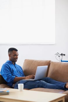 Man, laptop and freelancer for remote work at home, plan and copywriting in living room. Black male person, mockup space and connection for research on website, information and typing an article