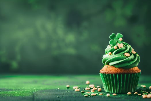 Cupcake with green cream and shamrock leaf.