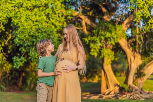 Heartwarming outdoor bonding as a pregnant mom and her son enjoy quality time together, savoring the beauty of nature and creating cherished moments