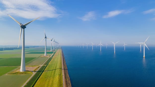 Aerial view of wind farm in ocean blending with natural landscape
