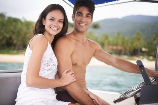 Couple, portrait and driving boat on ocean holiday or explore sea on vacation adventure, travel or steering wheel. Man, woman and happy in Hawaii or outdoor journey or coast, transportation or nature