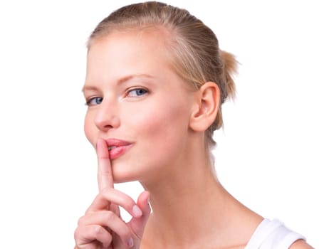 Woman, portrait and finger with secret in studio for noise, privacy and whisper for confidential mystery. Model, person and face with shush gesture for silence, gossip or surprise on white background