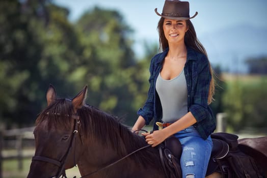 Woman, portrait and horse or countryside ranch in nature as equestrian for adventure, training or cowboy hat. Female person, saddle and western cowgirl in Texas or farm environment, outdoor or rural