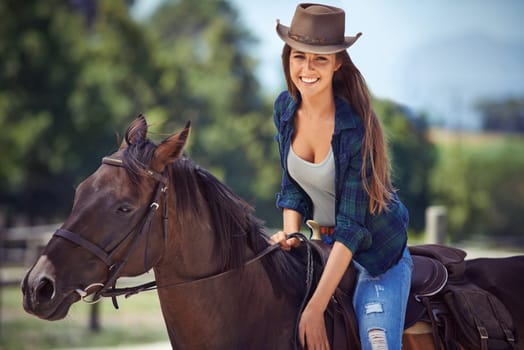 Woman, portrait and horse or ranch environment in nature as equestrian for adventure,, training or cowboy hat. Female person, stallion and western cowgirl in Texas or countryside, outdoor or rural