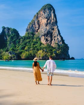 Railay Beach Krabi Thailand, a couple of men and woman on the beach in Thailand