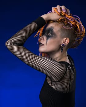 Cinematic portrait of beauty woman with colored braids hairdo, spooky stage make-up painted on face