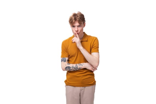 a young man with red hair feels confused on a white background