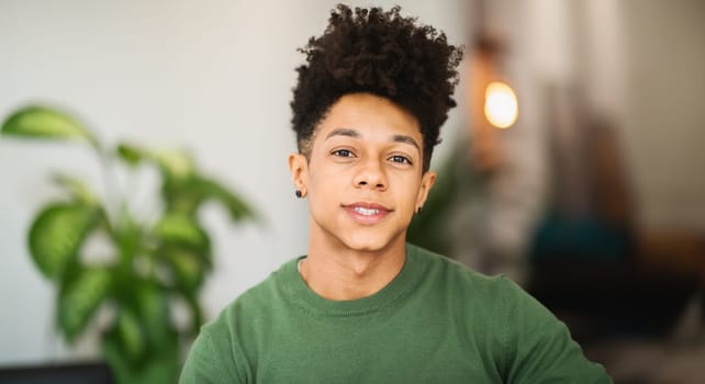 Portrait of handsome young african american guy posing at cafe